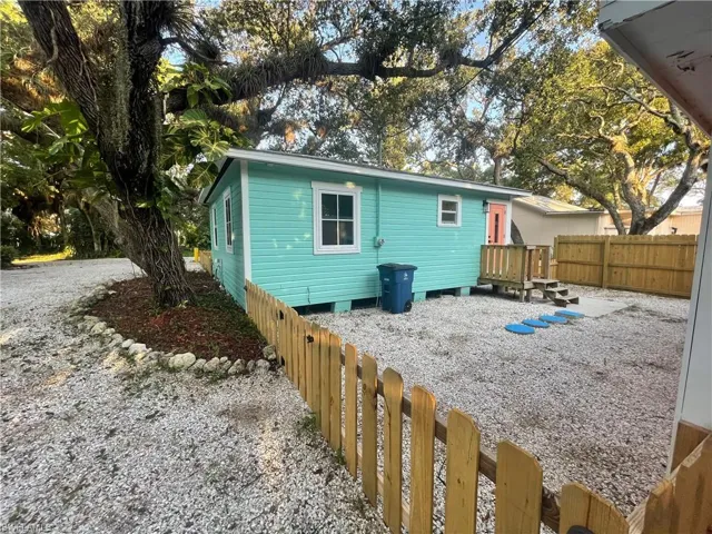 Back of house featuring a fenced backyard