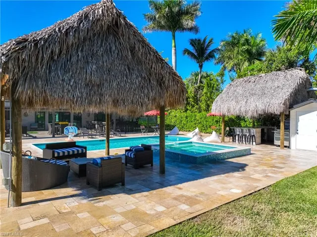 View of pool with a patio area, a pool with connected hot tub, a gazebo, and outdoor lounge area