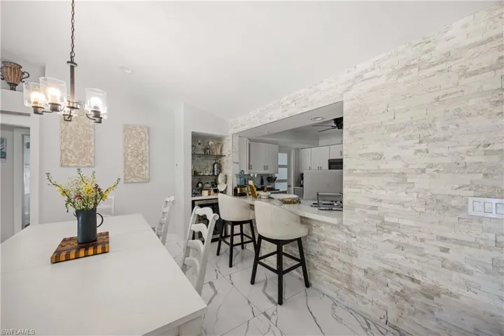 Dining room featuring lofted ceiling and a chandelier