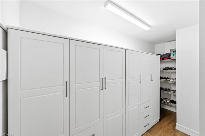 Walk-in closet with custom cabinets