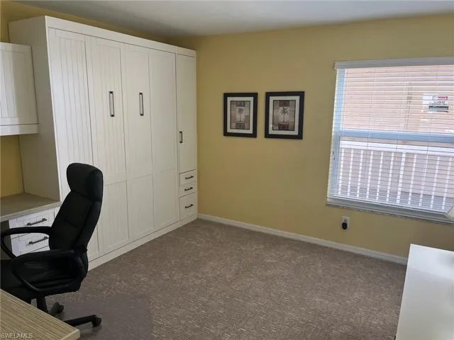 Built-in cabinetry with paneled doors and storage drawers