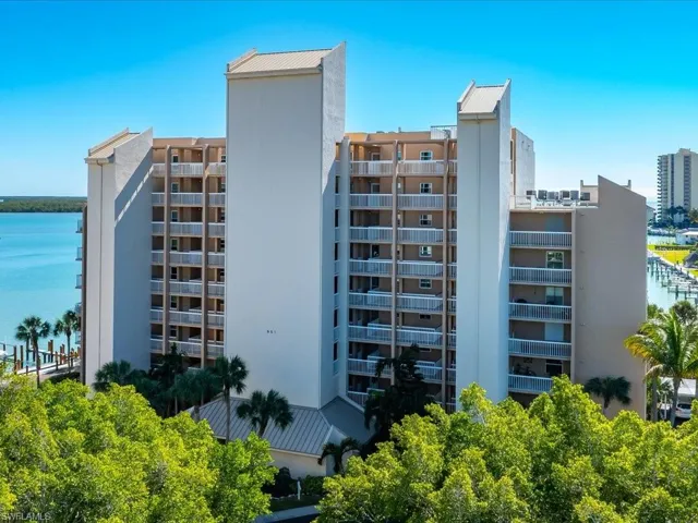 View of apartment building / complex with a water view