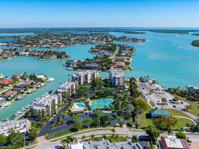 Aerial overview of property's location featuring a nearby body of water