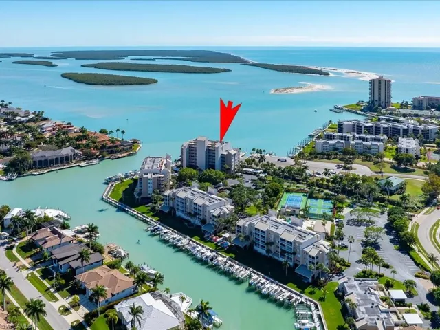 Aerial overview of property's location with a large body of water