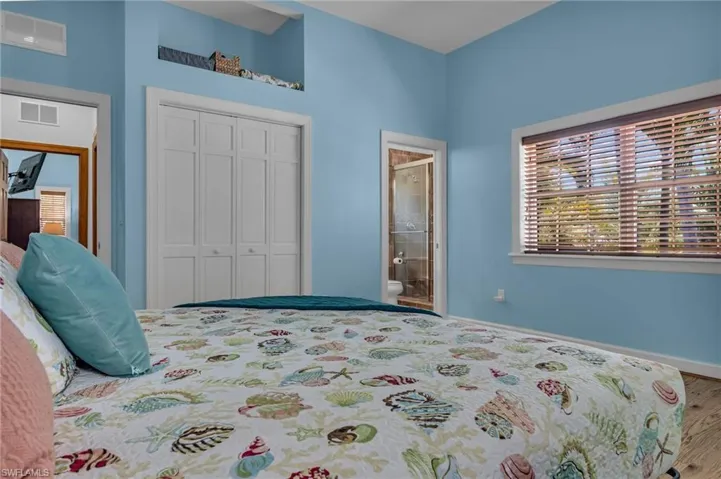 Bedroom with a closet, baseboards, and visible vents