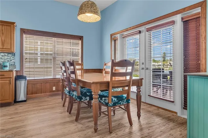 Dining room with baseboards and light wood-style floors