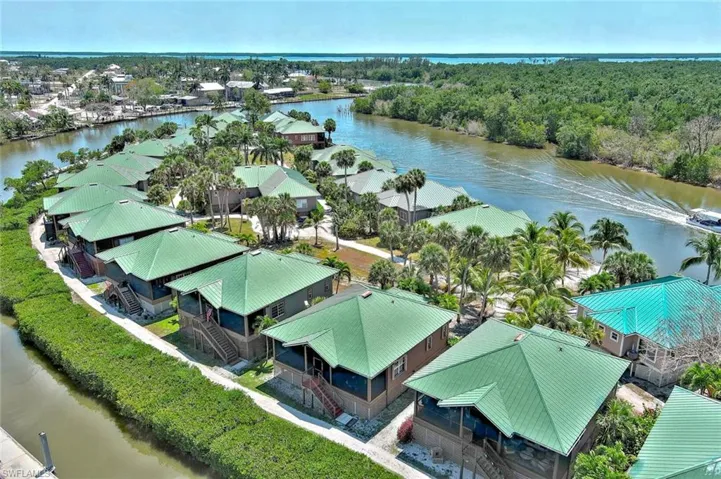Drone / aerial view with  a residential view, and a water view