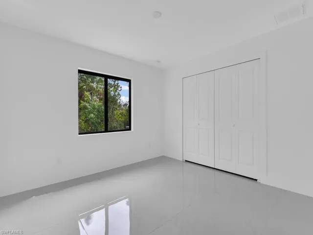 Unfurnished bedroom featuring a closet