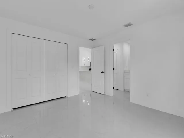 Unfurnished bedroom featuring a closet
