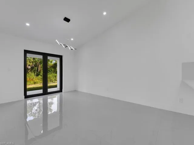 Unfurnished room with recessed lighting and light marble finish flooring