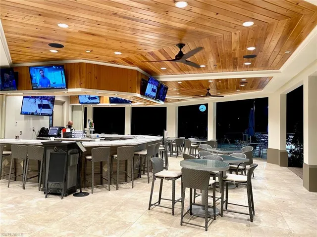 View of patio / terrace with an outdoor bar and ceiling fan
