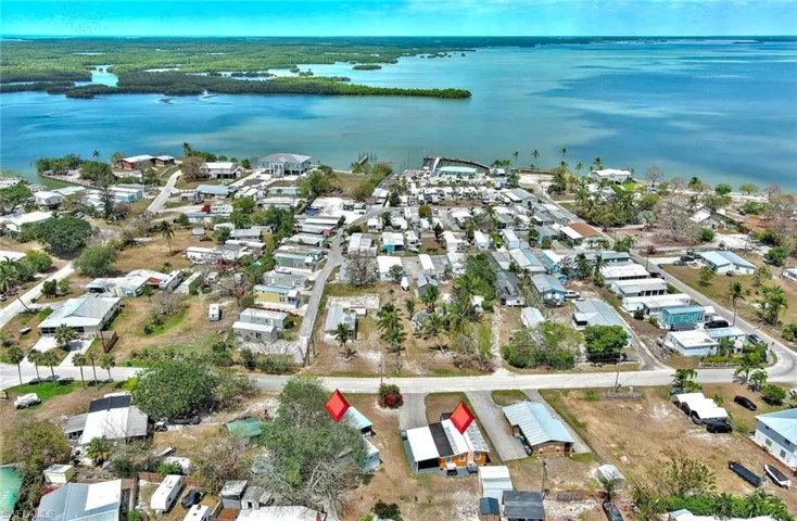 Drone / aerial view featuring a water view and a residential view