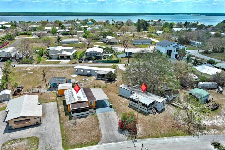 Drone / aerial view featuring a water view and a residential view