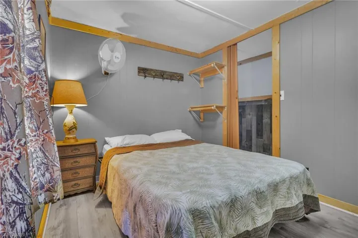 Bedroom with wood finished floors