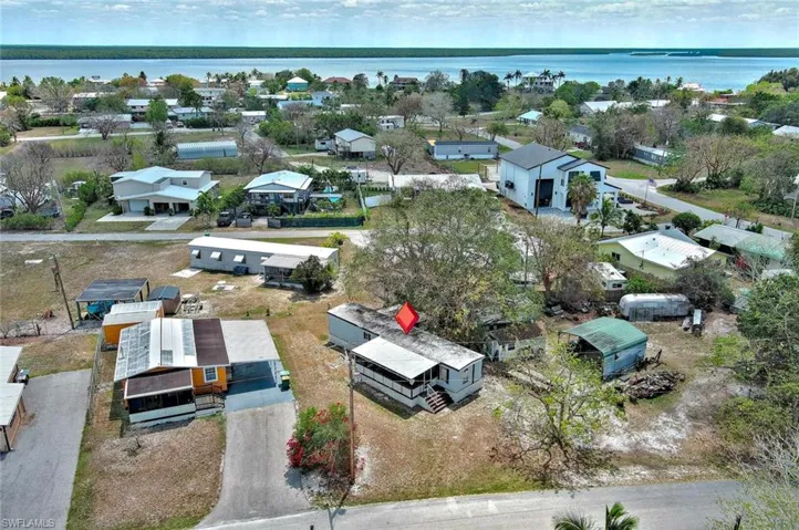 Aerial view with a water view and a residential view