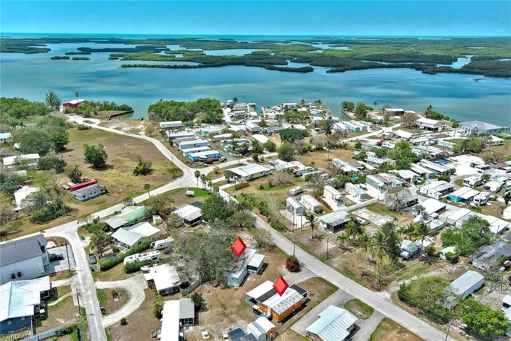 Aerial view featuring a residential view and a water view