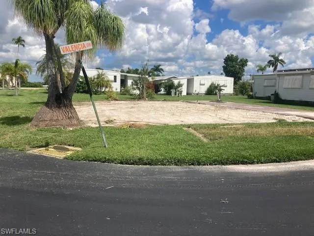 View of home's community with a lawn