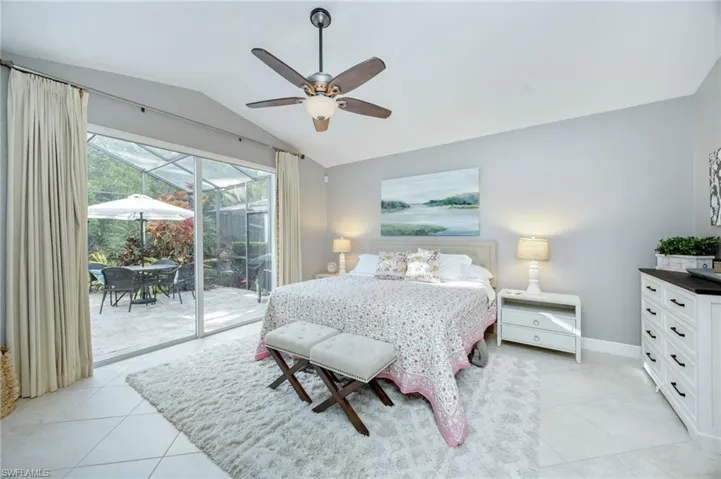 Bedroom with a sunroom, ceiling fan, access to exterior, and light tile patterned flooring