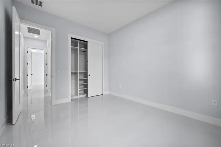 Unfurnished bedroom featuring a closet and tile patterned flooring