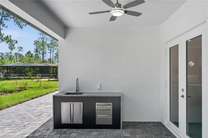 View of patio / terrace featuring a sink and ceiling fan