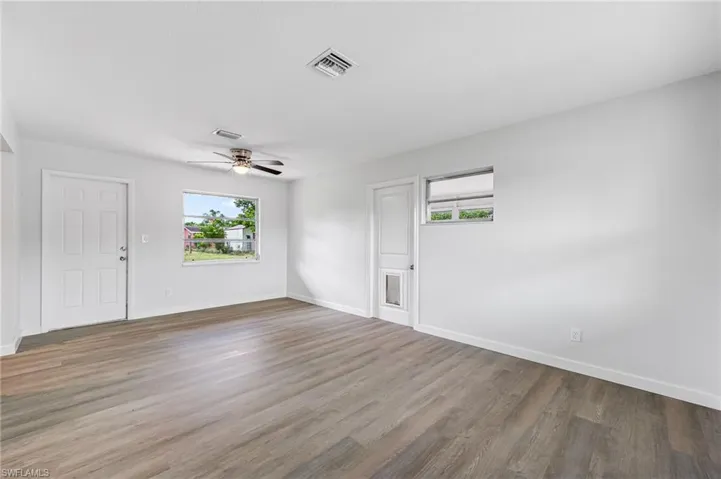 Spare room featuring ceiling fan and wood-type flooring