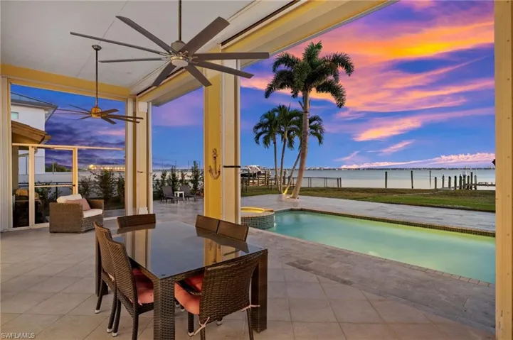 Covered lanai overlooking the pool and river