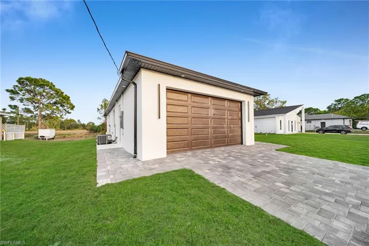Garage featuring driveway