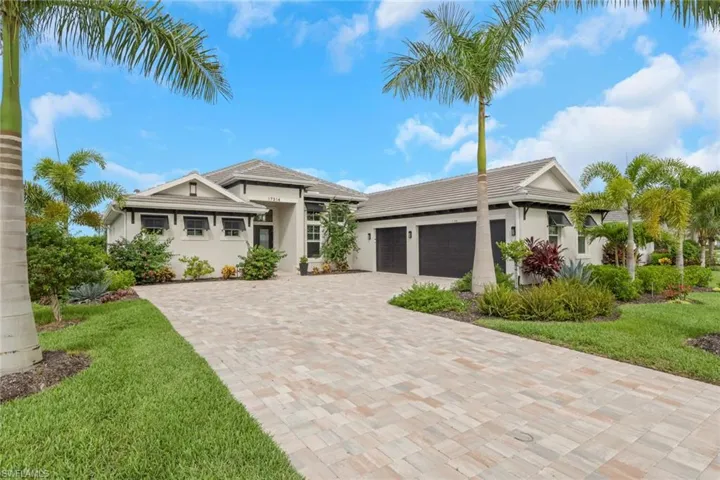 Contemporary exterior with a neutral stucco finish and dark trim accents