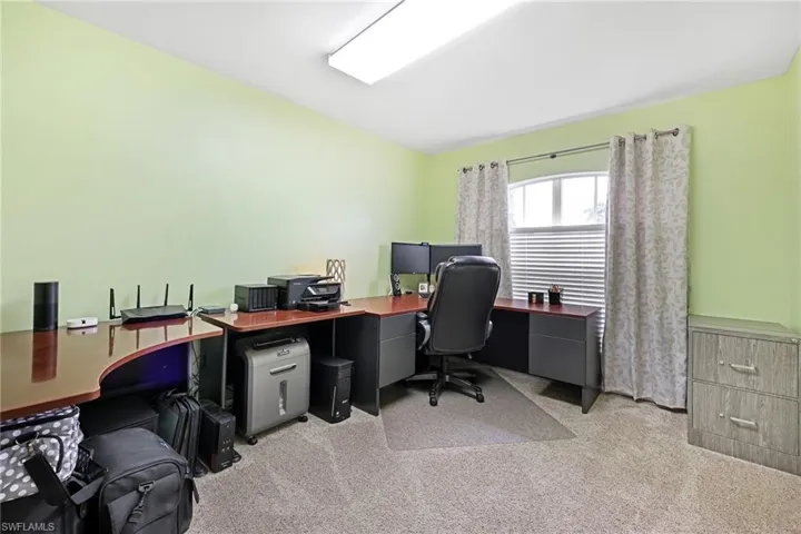 Office featuring light colored carpet