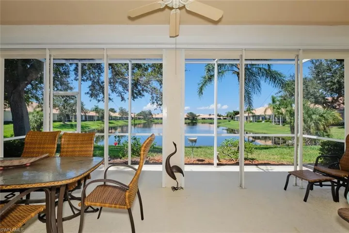 Sunroom with a water view