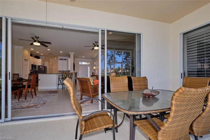 Dining space featuring recessed lighting, light tile patterned flooring, a ceiling fan, and ornamental molding