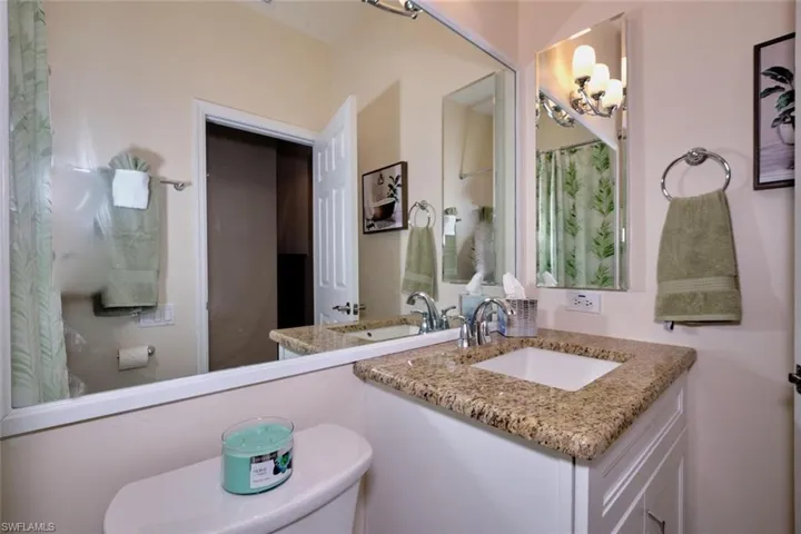Bathroom featuring vanity and a shower with shower curtain