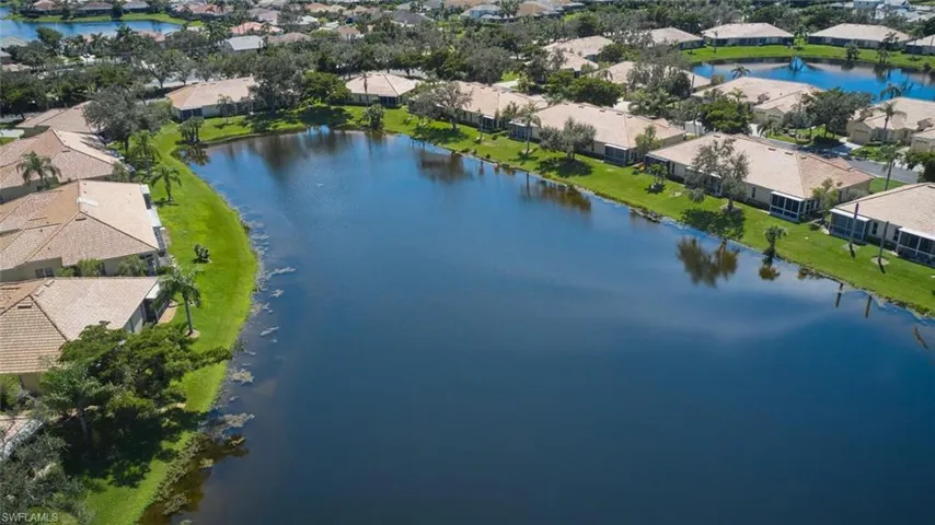 Aerial perspective of suburban area with a large body of water