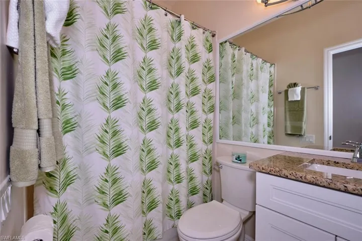 Bathroom with vanity and a shower with curtain