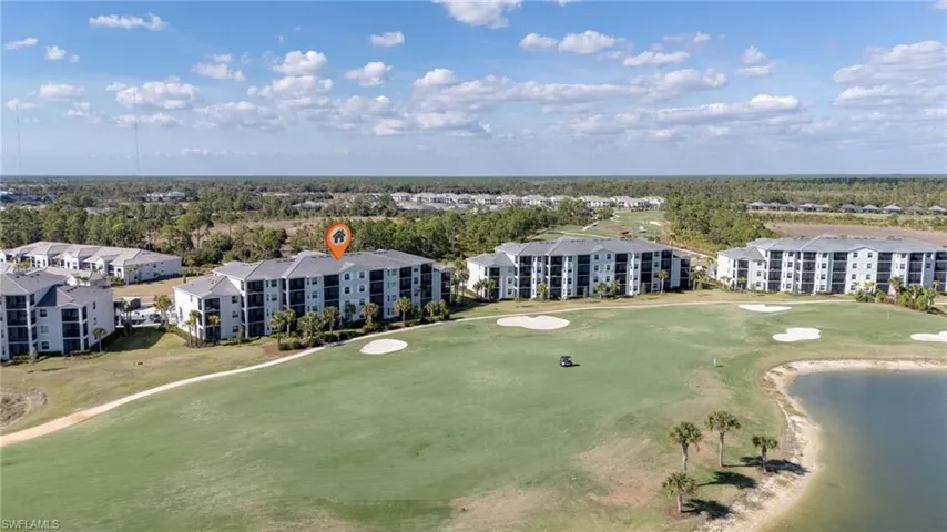 Bird's eye view of a golf club and a nearby body of water