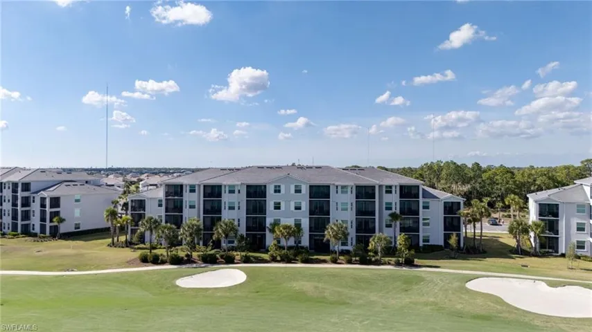 View of apartment building / complex featuring golf course view