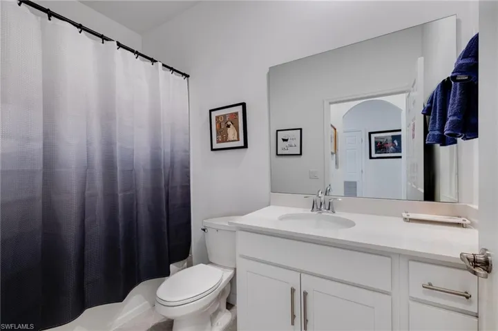 Bathroom featuring vanity and a shower with curtain