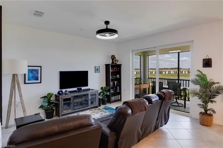 Living room featuring light tile patterned floors