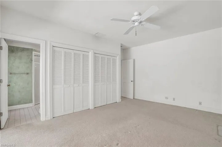 Ensuite Guest Bedroom 1 with ceiling fan and pool access