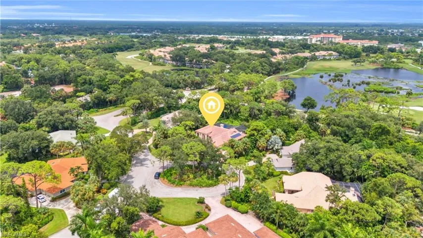 Aerial view of home and golf course proximity