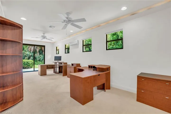 Office space featuring custom built-ins and decorative molding