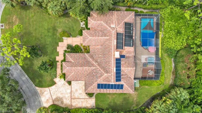 Drone/aerial view of property showcasing pool and landscaping