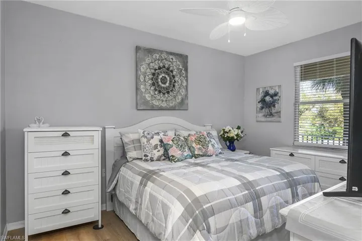 Bedroom with light wood-style flooring and ceiling fan