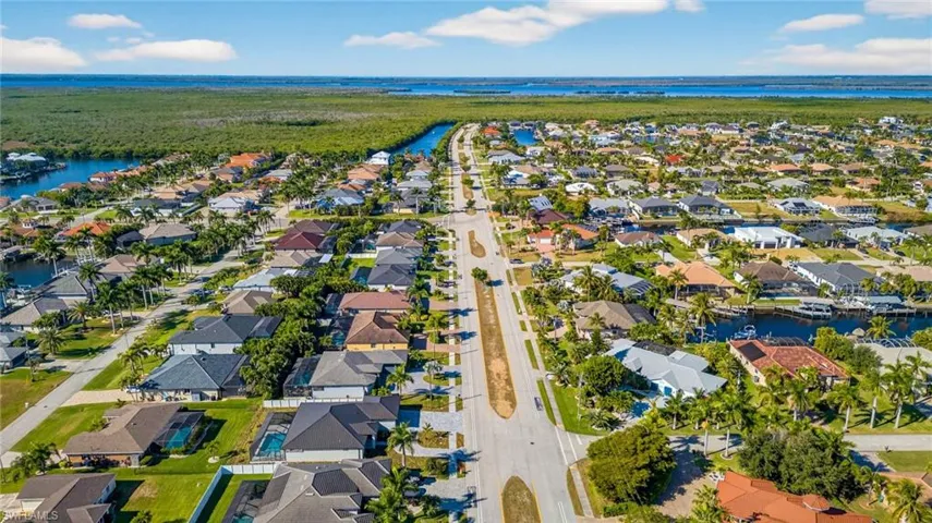 Aerial view of residential area with a large body of water