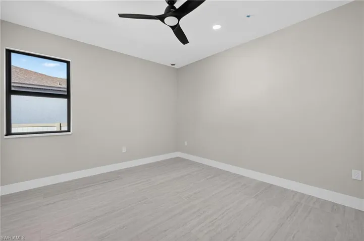 Spare room with light wood-style floors, ceiling fan, and recessed lighting