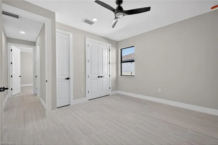 Unfurnished bedroom featuring a ceiling fan, a closet, and recessed lighting
