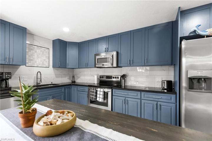 Upgraded black granite countertops, with plenty of work space.