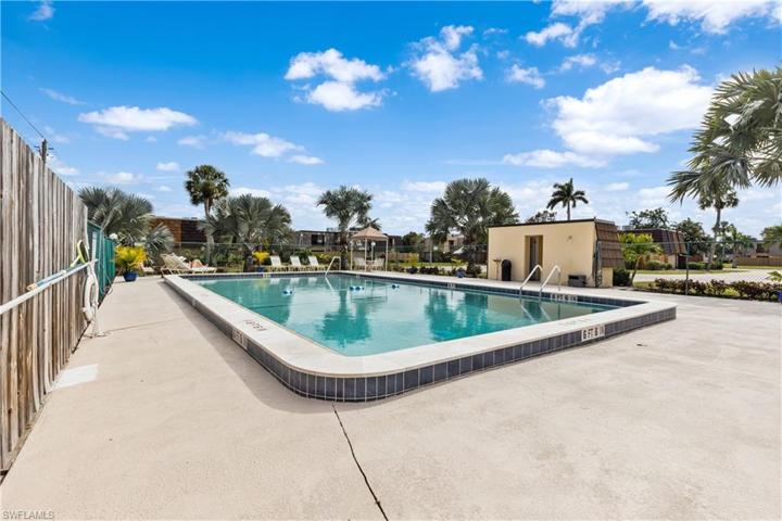 Two restrooms, water fountain and shower in pool area