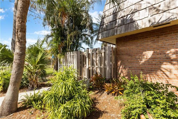 Privacy fence leading to entrance of home