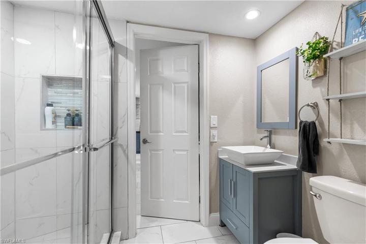 Shower niche with glass tile inlay